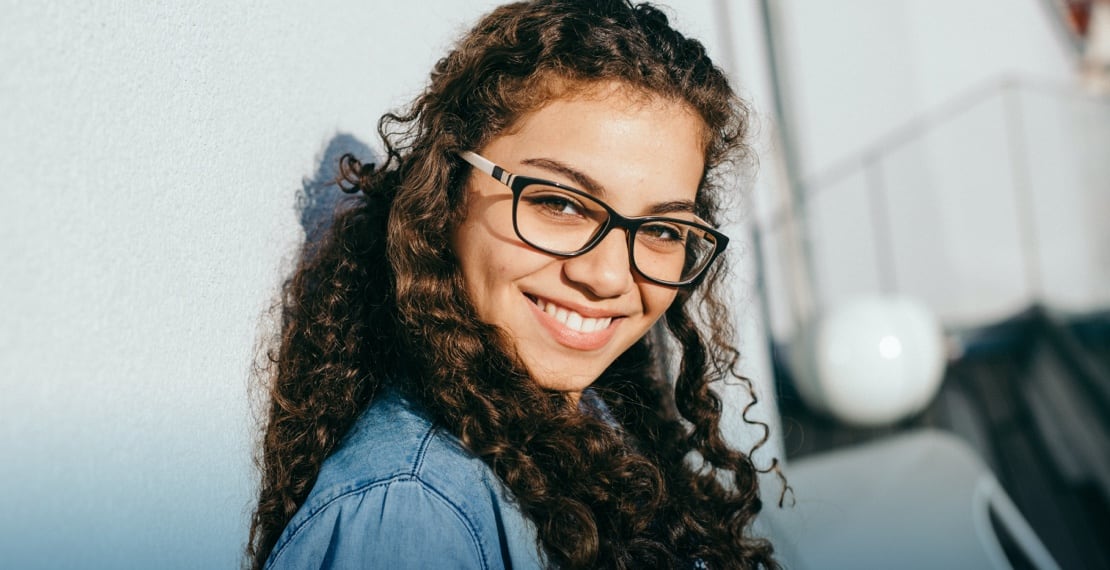 woman smiling wearing glasses