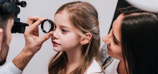 Young girl getting an eye exam